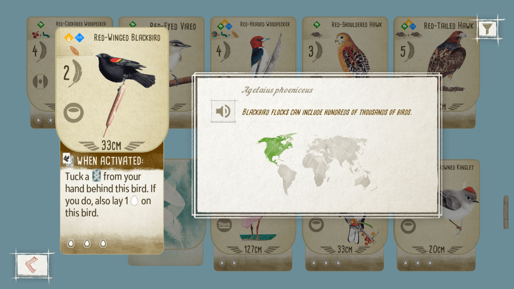 Entry for a red-winged blackbird in Wingspan. There is a picture of the bird on the game card, and a map of the world with North America highlighted in green, demonstrating where this bird lives.