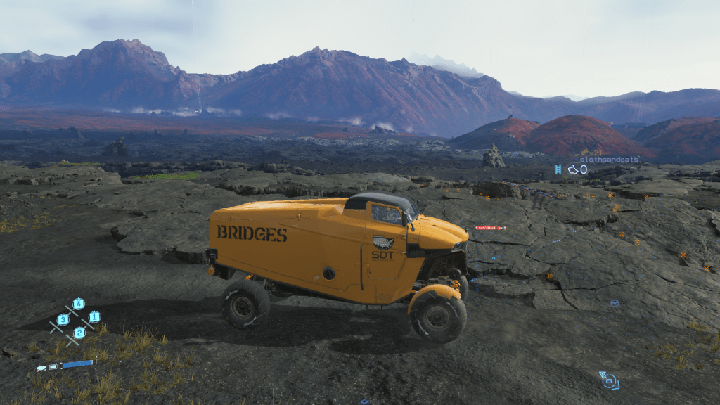 Image of a Bridges truck overlooking a mountain range and rocky terrain